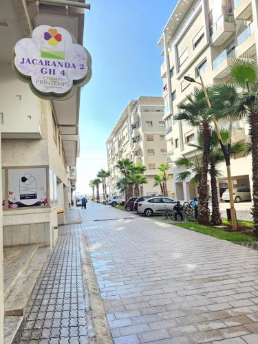 a cobblestone street with a sign on a building at MIA Appartement N2 - Élégance, Confort et Sérénité in Casablanca