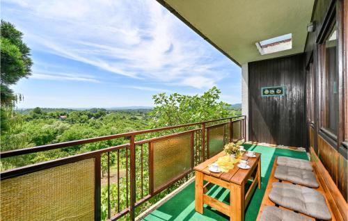 a balcony with a wooden table and a view at Lovely Home In Gornja Reka With Wifi in Lokošin Dol