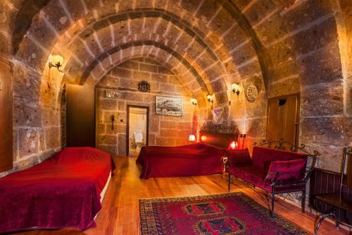 Postel nebo postele na pokoji v ubytování Kapadokya Ihlara Konakları Otel Antik Konaklar