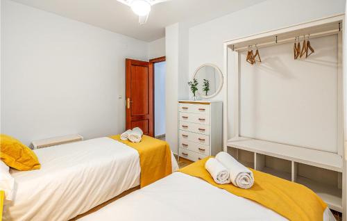 a bedroom with two beds and a dresser at Stunning Air Conditioned House in Cijuela