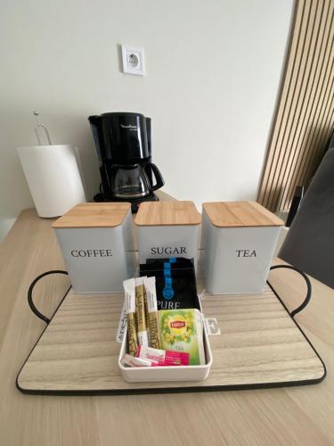 a table with three boxes on top of it at G&M Home in Elassona
