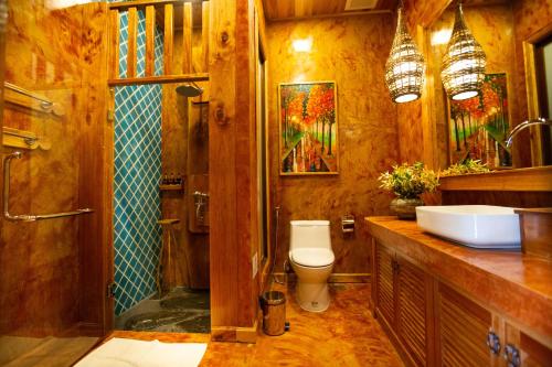 a bathroom with a toilet and a sink and a shower at Andalay Beach Resort Koh Libong in Ko Libong