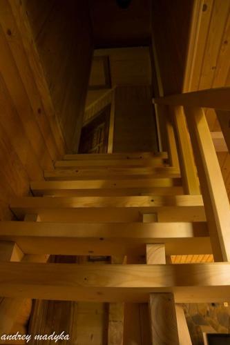 an overhead view of a wooden staircase in a cabin at Eco Sadyba Familia in Yaremche