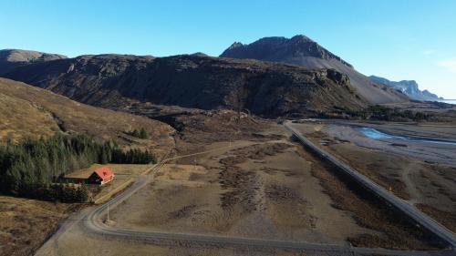 an aerial view of a dirt road in a mountain at Lodge Borgarbrekka in Lón South East of Iceland - Birta Rentals in Höfn