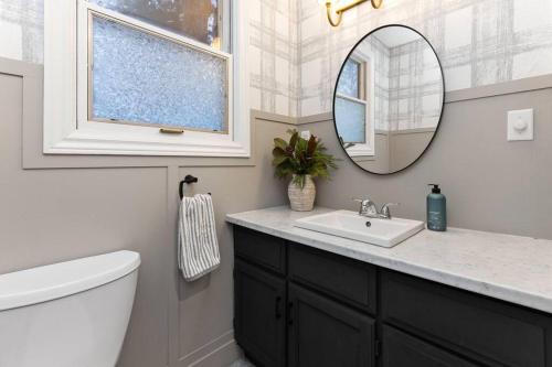 a bathroom with a sink and a mirror at 4Bdrm Muskoka Retreat, Fire Table, Games, Netflix in Port Carling