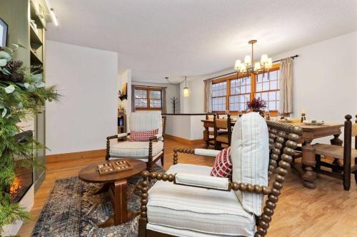 a living room with a table and chairs at 4Bdrm Muskoka Retreat, Fire Table, Games, Netflix in Port Carling