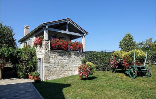 a house with flower boxes on the window at Villa Pepa in Zarečje
