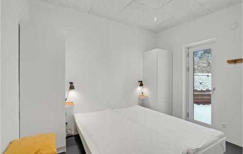 a white bedroom with a bed and a window at Beautiful Home In Vestervig With Wifi in Vestervig