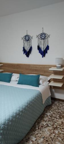 Ένα ή περισσότερα κρεβάτια σε δωμάτιο στο Casa dei sospiri