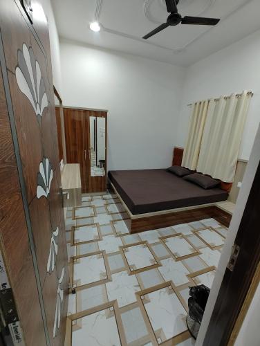 Postel nebo postele na pokoji v ubytování Omisha Guest House