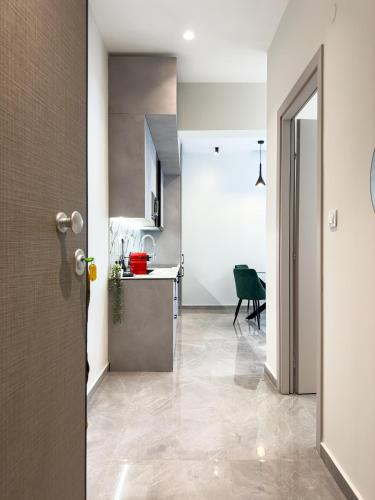a kitchen and a dining room with a table at VILLA 8 By ProLiving Hospitality in Thessaloniki