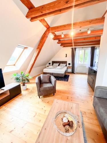 a living room with a couch and a table at Luxuriöses Bauernhaus mit Garten und Parkplatz in Straß in Steiermark