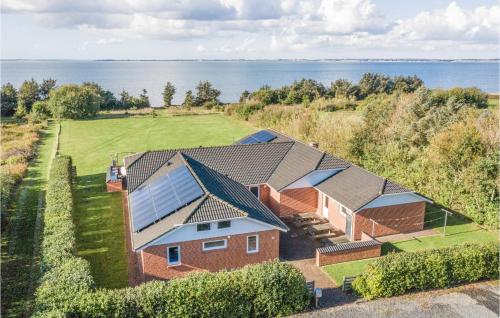 an aerial view of a house with a solar roof at Stunning Home In Spøttrup With Sauna in Vadum