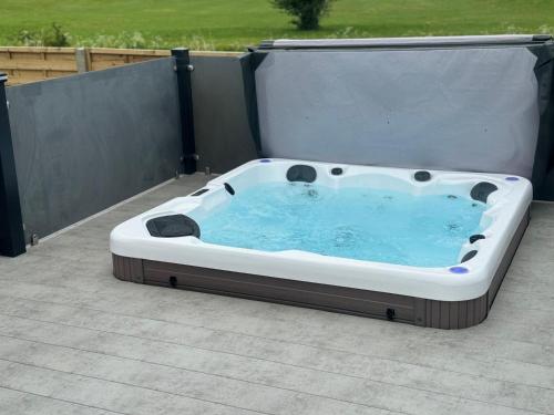 a hot tub sitting on top of a patio at The Kings Head inn in Addlethorpe