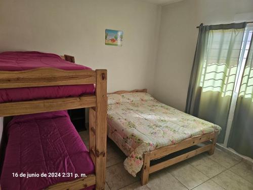 Postel nebo postele na pokoji v ubytování Casas de Carlos en San Rafael COMPLEJO RIO BAMBA