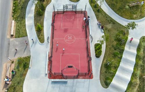an overhead view of a parking lot with a car at Gorgeous Home In Lembruchdümmer See in Lembruch