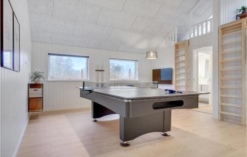 a large room with a table in the middle of it at Stunning Home In Jægerspris With Sauna in Jægerspris