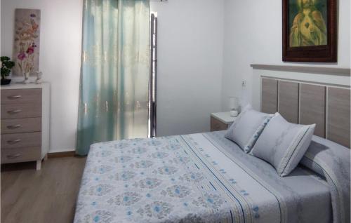 a bedroom with a bed and a dresser at Beautiful Home In Nerja With Wifi in Nerja