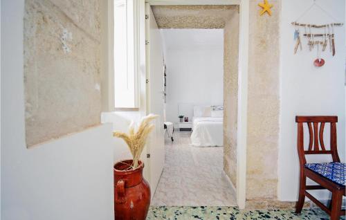 a room with a hallway with a vase on the floor at Nice Home In Cava D'aliga With Wifi in Cava dʼAliga