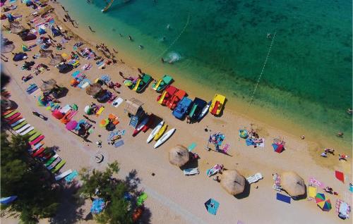 an overhead view of a beach with a crowd of people at Lovely Apartment In Kustici With Wifi in Kustići