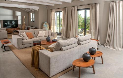 a living room with a couch and tables at Villa Casa Cupra in Umag