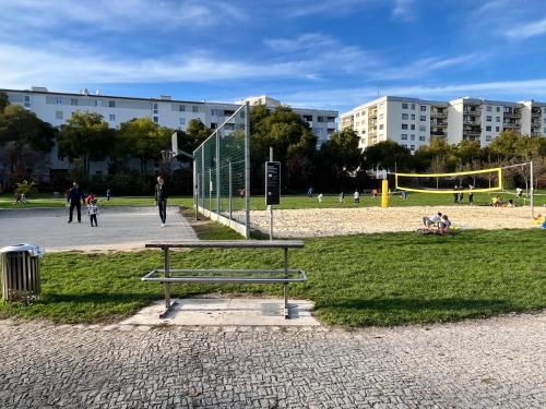 a park with a bench and a volley ball net at Luxury apartment with parking in Graz