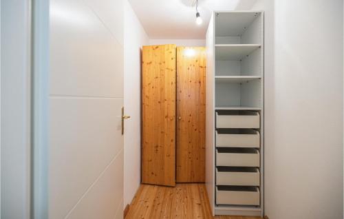 a room with a wooden door and a ladder at Arkadenhaus Apartment 63M² in Oberwart