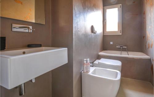 a bathroom with a sink and a toilet at Amazing Apartment In Marzabotto in Marzabotto