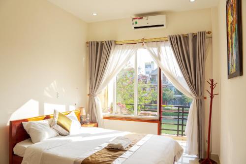 Katil atau katil-katil dalam bilik di Khách sạn 68 ĐỒNG HẢI