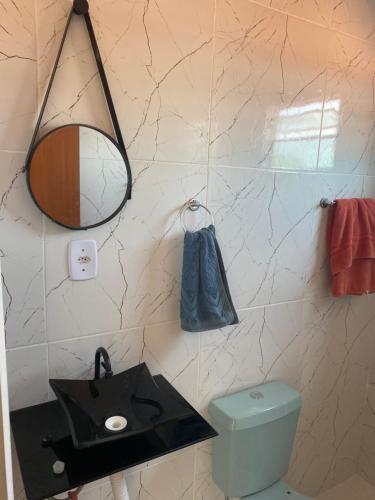 Bilik mandi di Flats com ar condicionado, garagem e internet