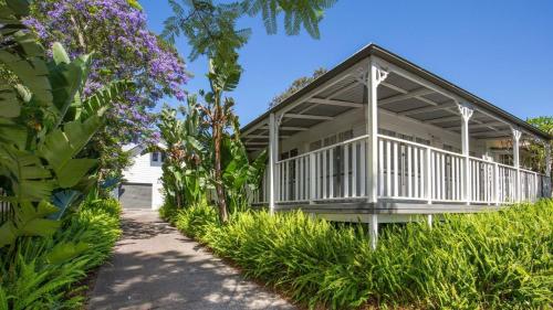 a house with a walkway leading to it at Bali Huts Escape in Nowra