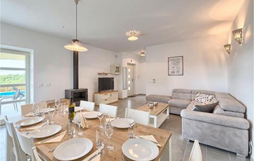 a living room with a table and a couch at Villa Lisa in Poreč