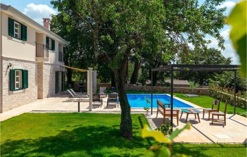 a yard with a swimming pool and a house at Villa Lisa in Poreč