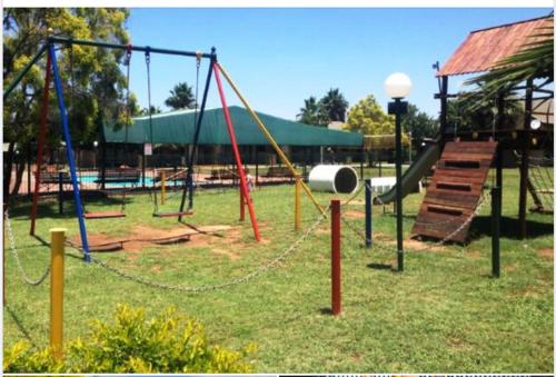 an empty playground with swings and a slide at 27 Pendleberry Grove, Chris Hani Drive, Bela-Bela in Bela-Bela