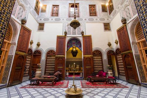 a building with a library with bookshelves and a synagogue at Riad Ibn Khaldoun in Fez