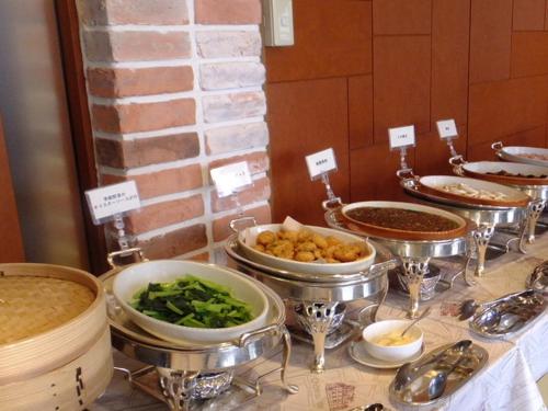 a buffet with many different dishes of food on a table at Koriyama View Hotel in Koriyama