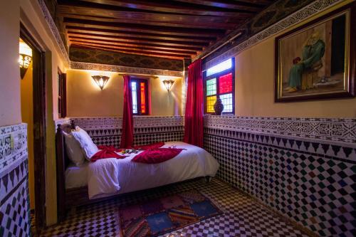 Cama o camas de una habitación en Riad Ibn Khaldoun