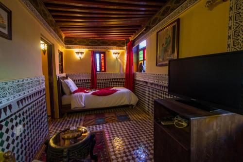 Cama o camas de una habitación en Riad Ibn Khaldoun