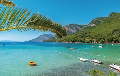 a view of a lake with boats in the water at Holiday Home Zuljana 21 in Žuljana