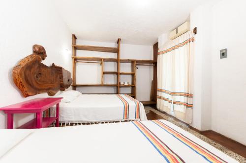 Postel nebo postele na pokoji v ubytování Hotel Casa Lasibe Café