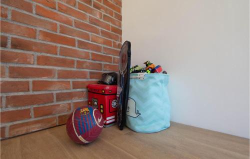 a brick wall with a bag and a baseball bat at Stunning Home In Obrovac Sinjski in Obrovac Sinjski