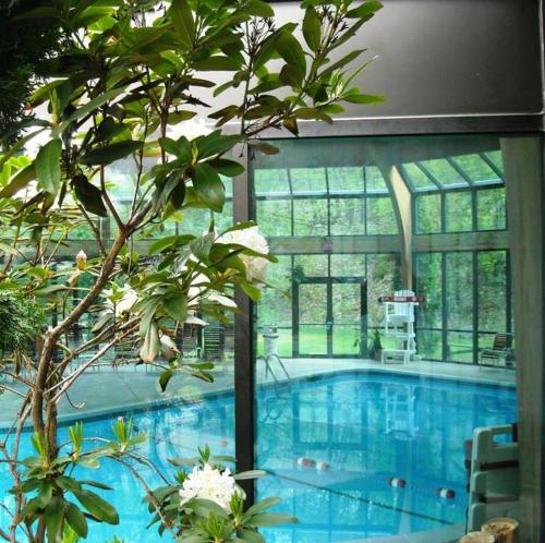 a large swimming pool in a building with a large window at Pocono Mountains Village at Camelback 284 Overlook Way in Tannersville