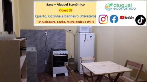 a kitchen with a stove and a table and a sign at Sana - Aluguel Econômico in Sana