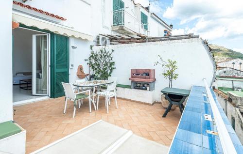 a patio with a table and chairs on a building at Beautiful Apartment In Raito With Wifi in Albori