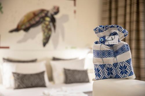 En eller flere senge i et værelse på The Artemis Hotel