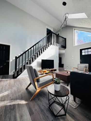 a living room filled with furniture and a staircase at Cabin near kalahari,camelback Ski in Long Pond