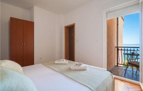 Posteľ alebo postele v izbe v ubytovaní Apartment Podstrana 3