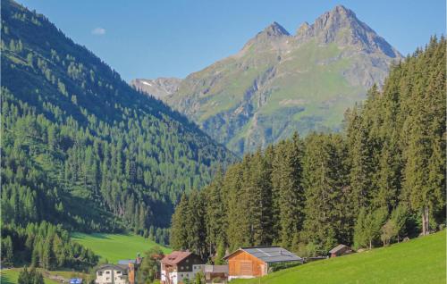 a village in a valley with mountains in the background at Ferienwohnung In Ischgl in Ischgl
