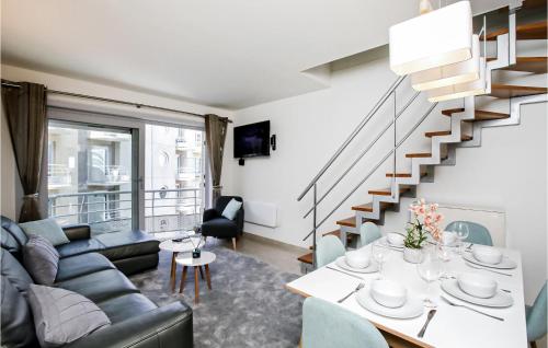 a living room with a couch and a table at Residentie Zeezicht in Ostend