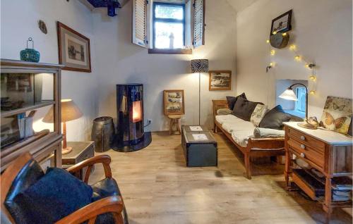 a living room with a couch and a table at 1 Bedroom Cozy Home In Plouézec in Plouézec